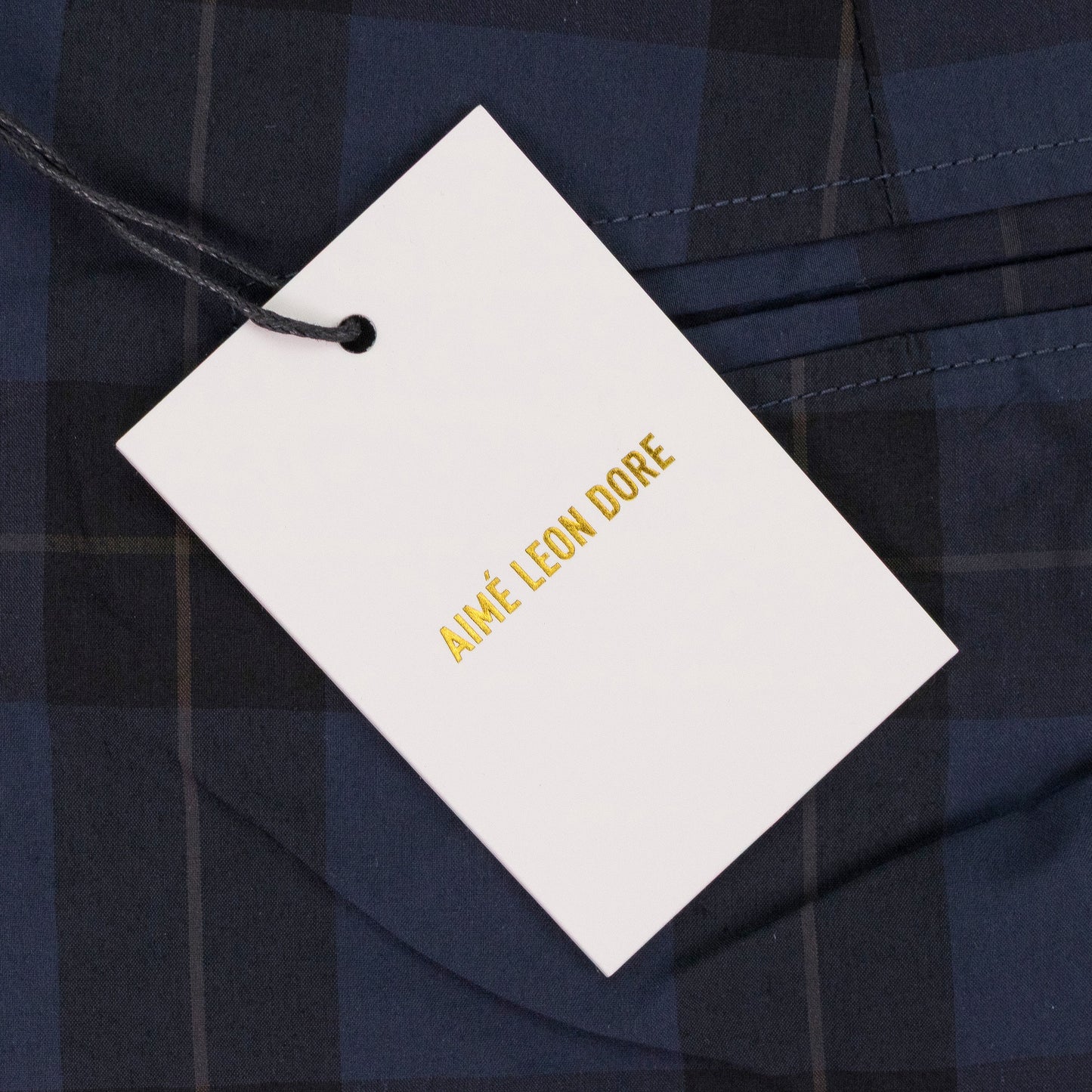 NAVY PLAID NYLON TROUSERS